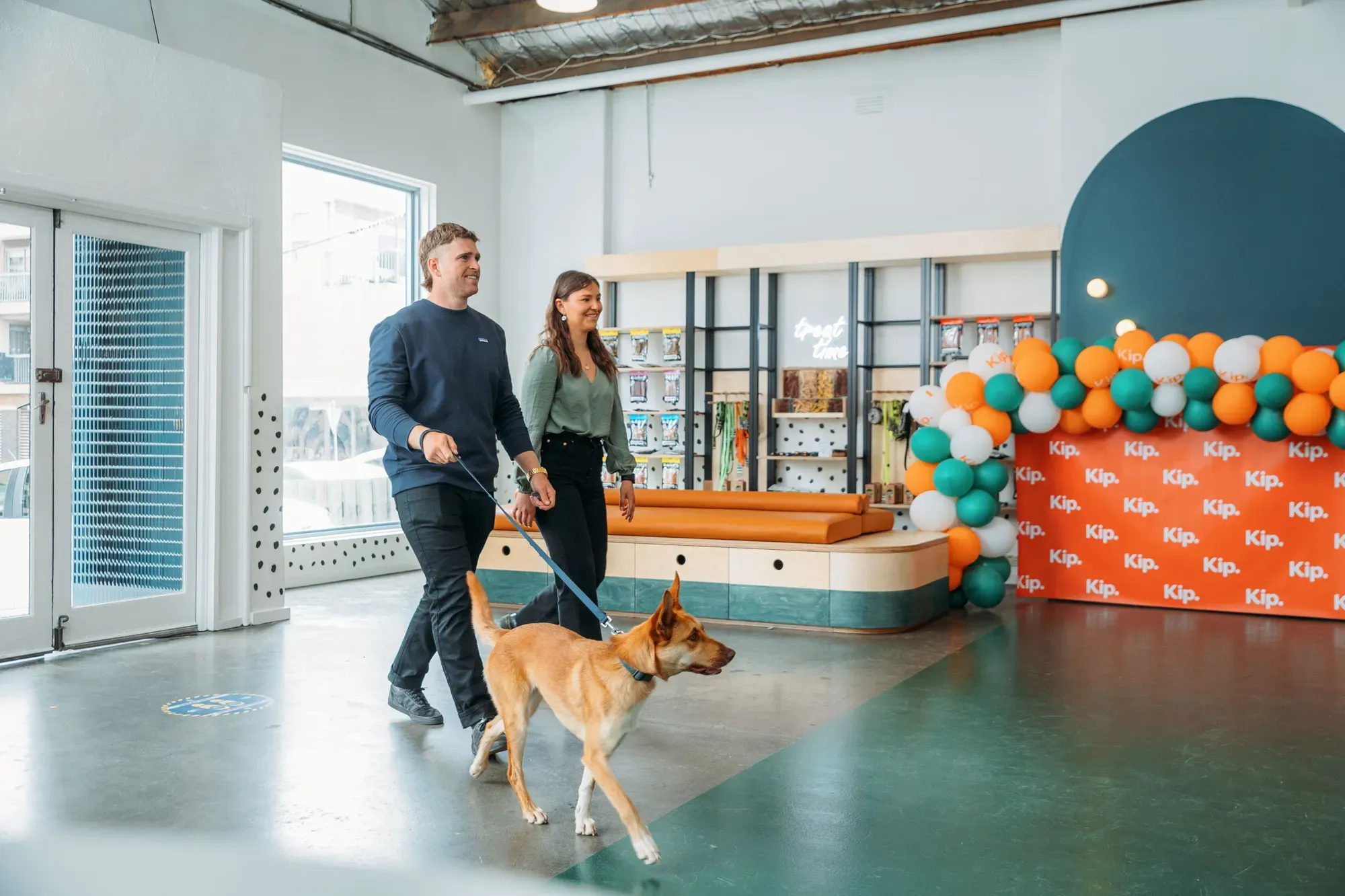 Owners walking in Kip with a dog